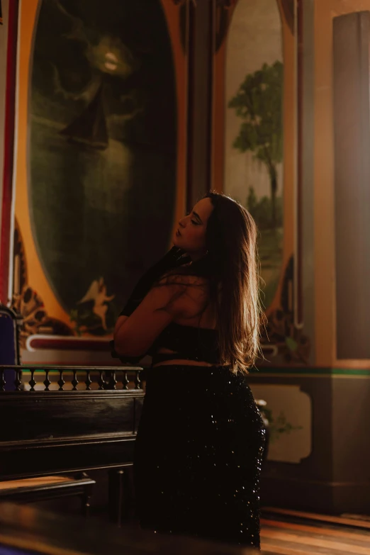 a woman is sitting in an ornate room