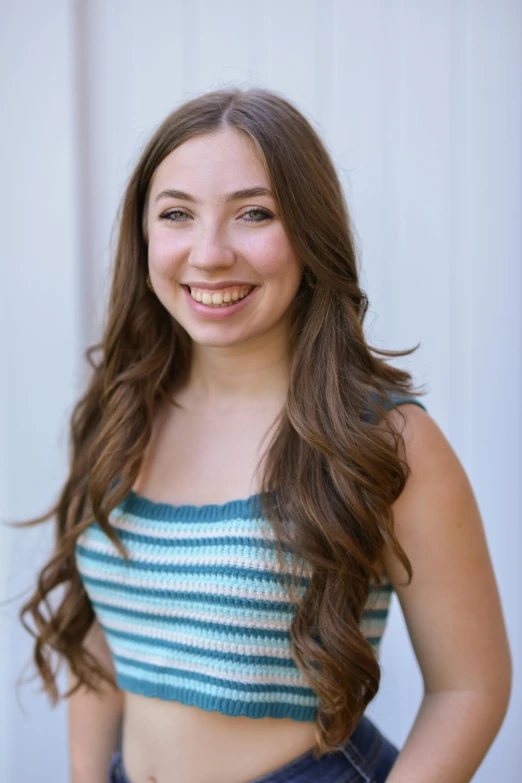 this is a beautiful woman with long hair smiling