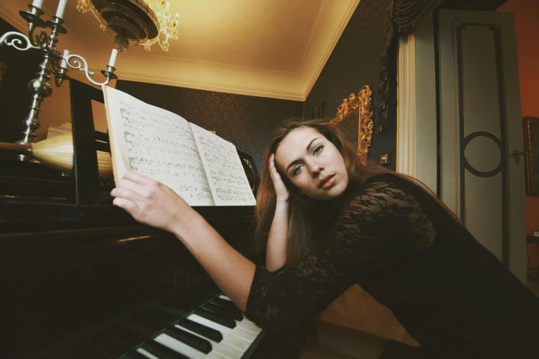 a young woman posing with a musical instrument