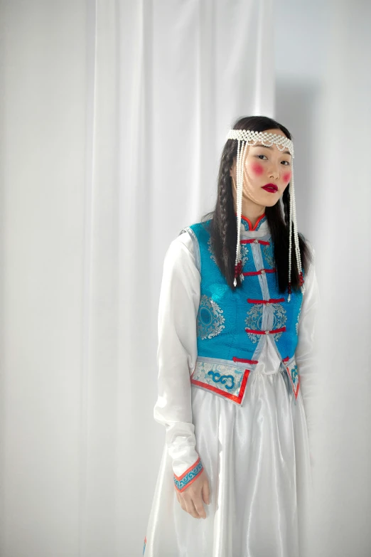 a woman dressed in a traditional costume for the celetion