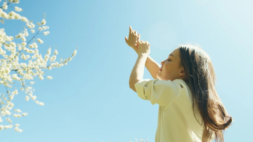 a young woman looking up into the sky