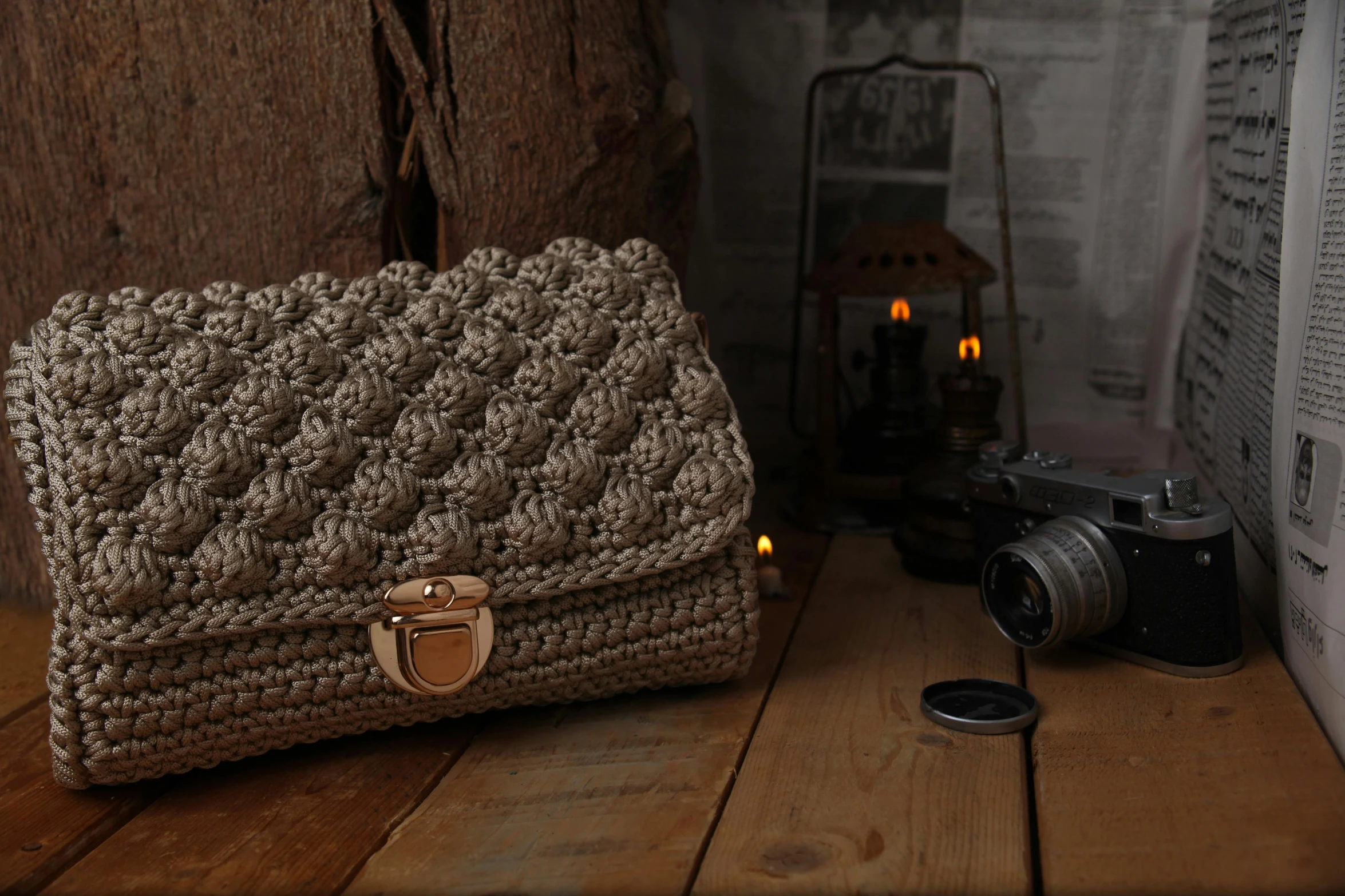 the handbag on the table is crocheted with yarn