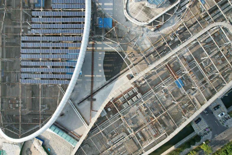 an aerial view of a street next to a building