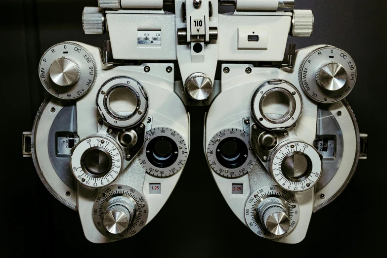 the four dials on a mechanical device are arranged