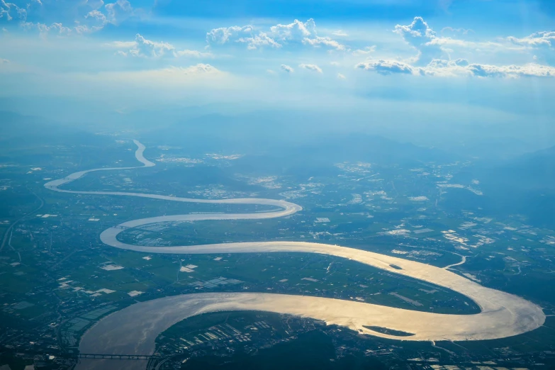 this is a view of an island with a river and mountains