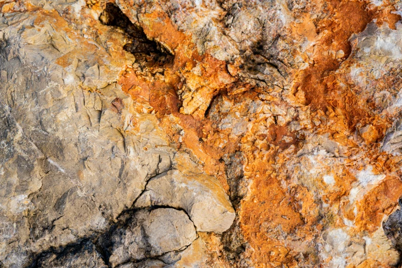 close up of a piece of old rock with rust on it