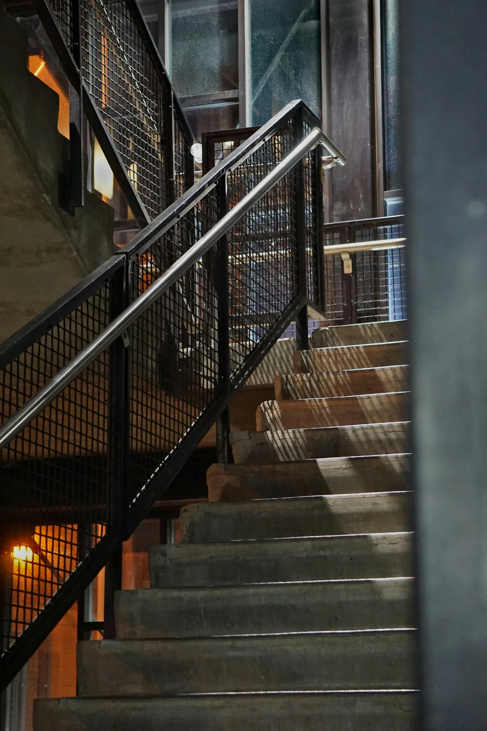 a person is walking up some stairs while a third hander pulls the rope