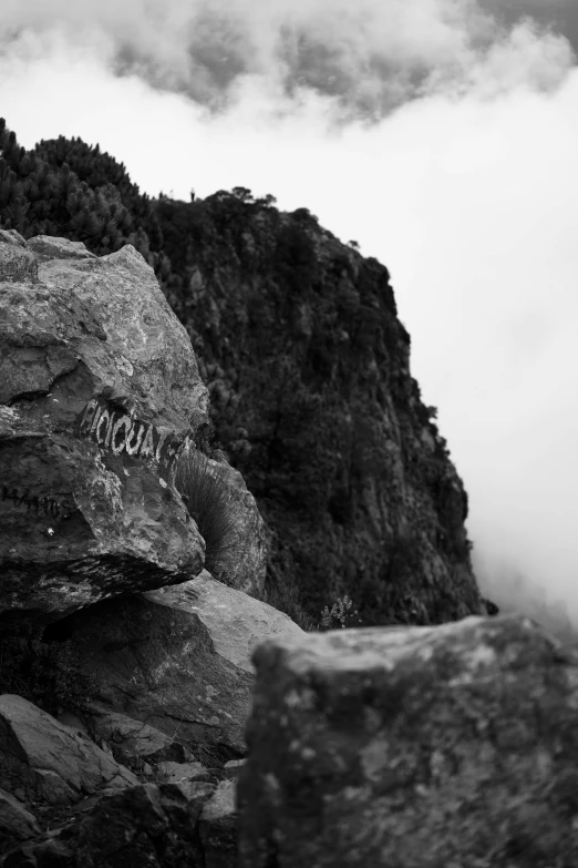 the po shows an outcropping of a cliff with a sign reading'do not enter the mountain '