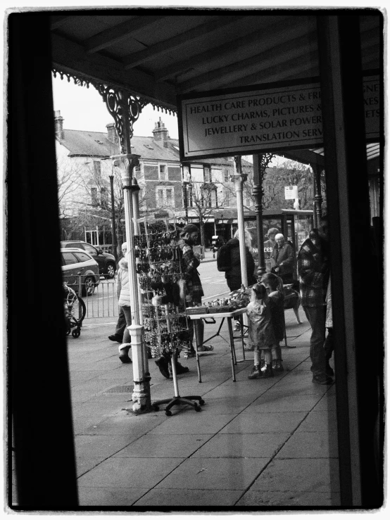 the view from inside the store on a street