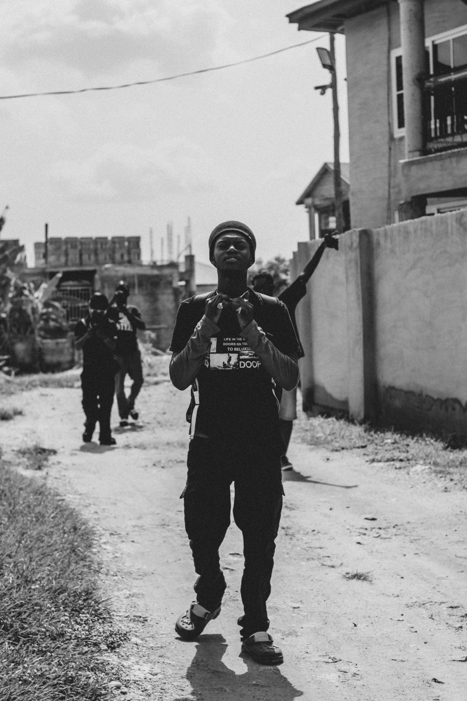 soldiers are marching down a small dirt road