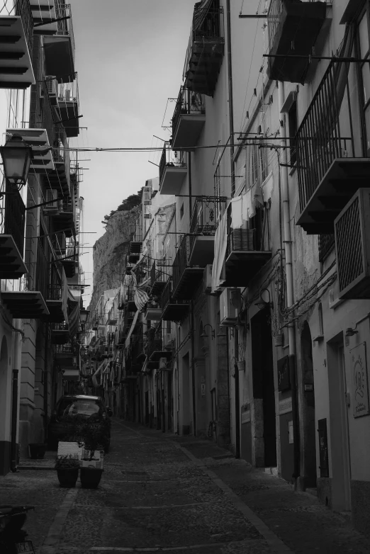 a black and white pograph of buildings and cars