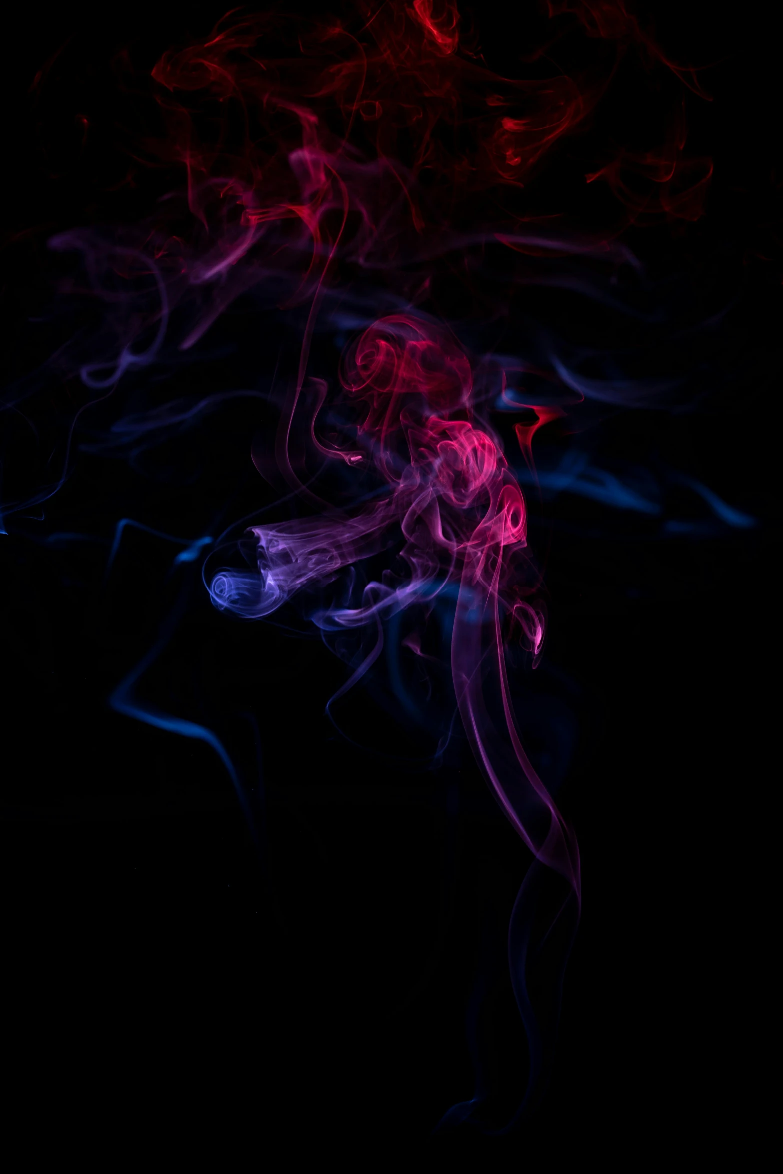 smoke in the dark, with bright red and blue colored lights