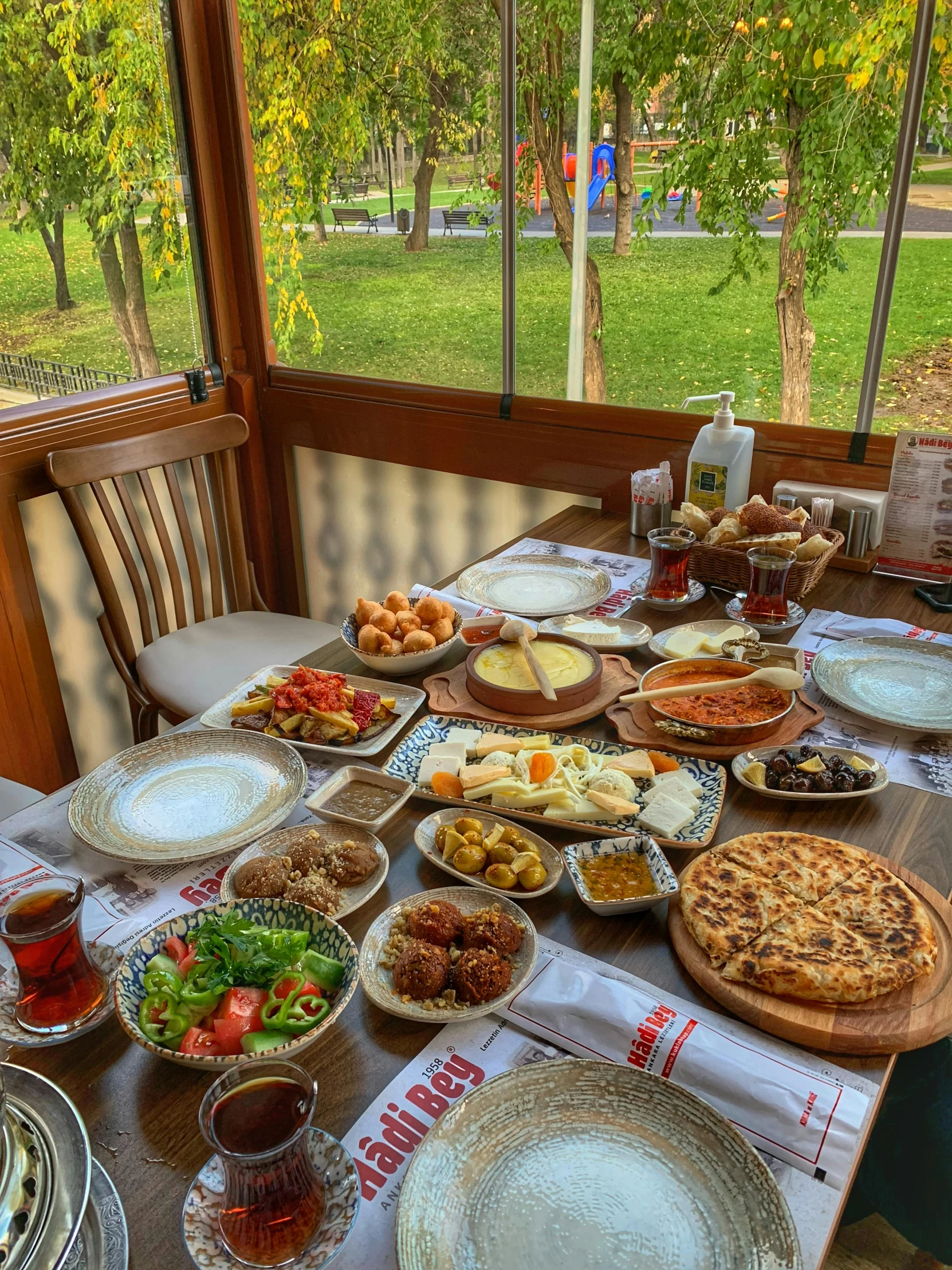 a table with many plates and other foods on it
