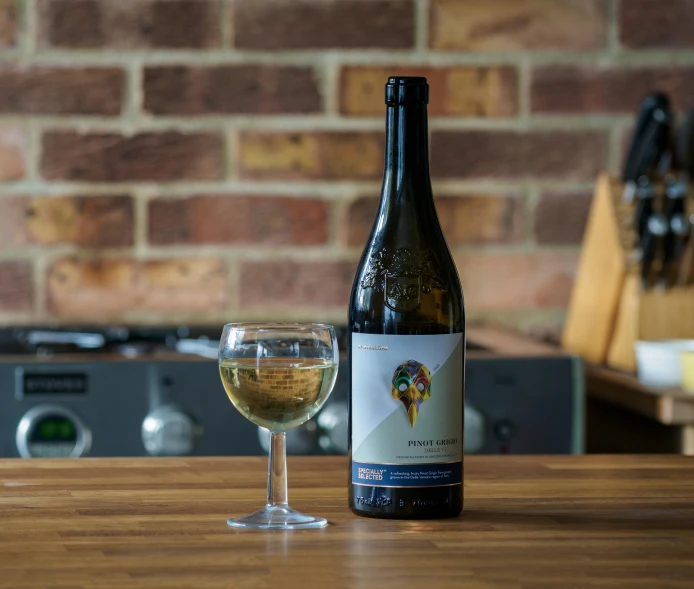 a bottle and a glass on a table