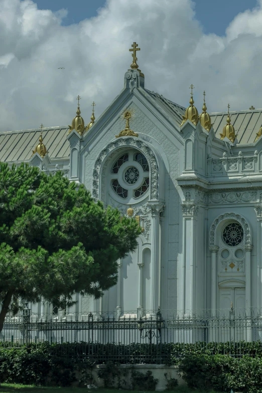 a large ornate building that is next to some trees