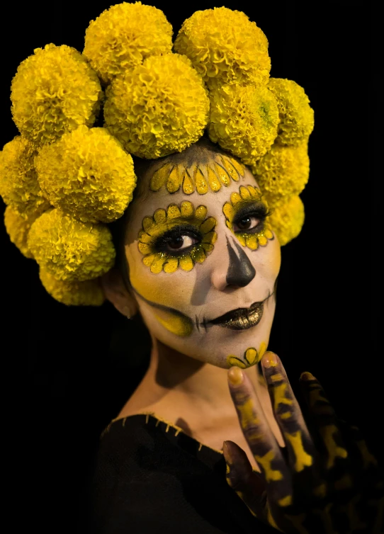 a woman with yellow makeup has yellow hair