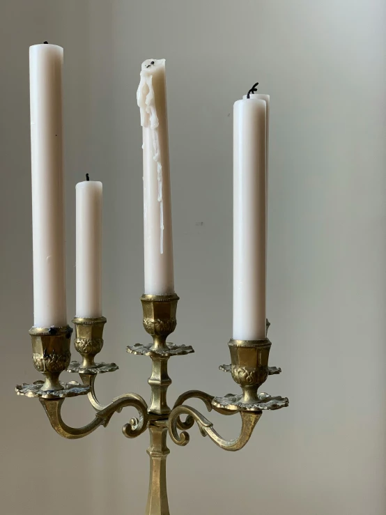 a candle is shown with three candles and three candles