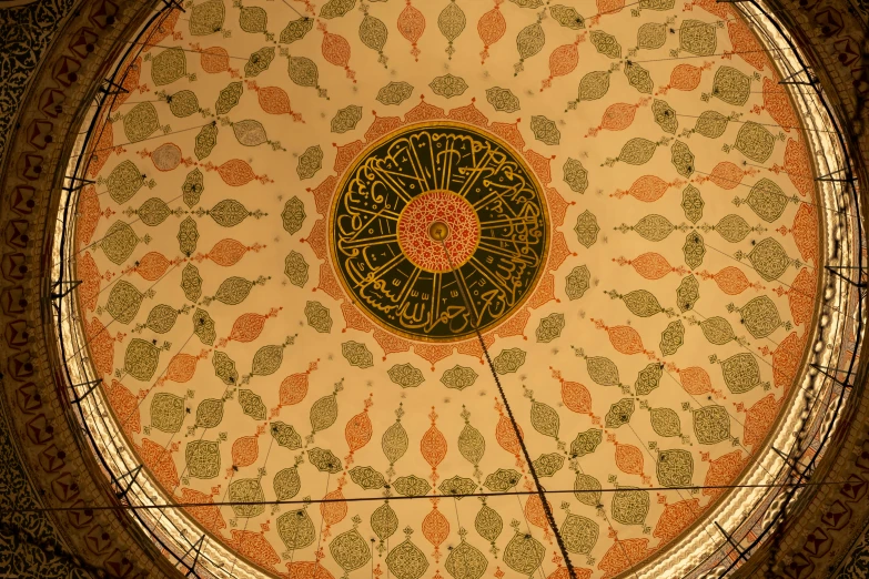 a ceiling in a building with a clock inside of it