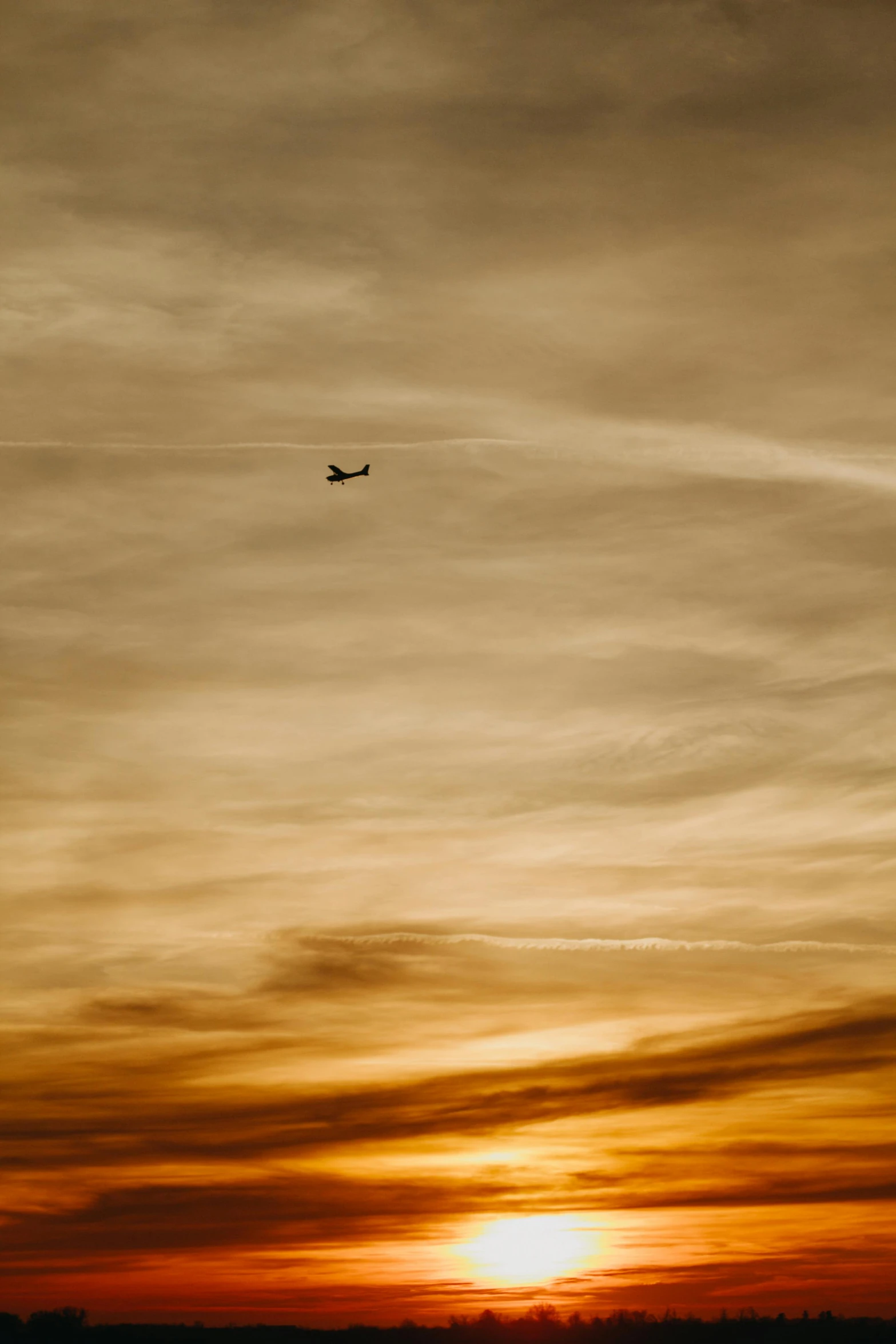 an airplane flying high up in the sky