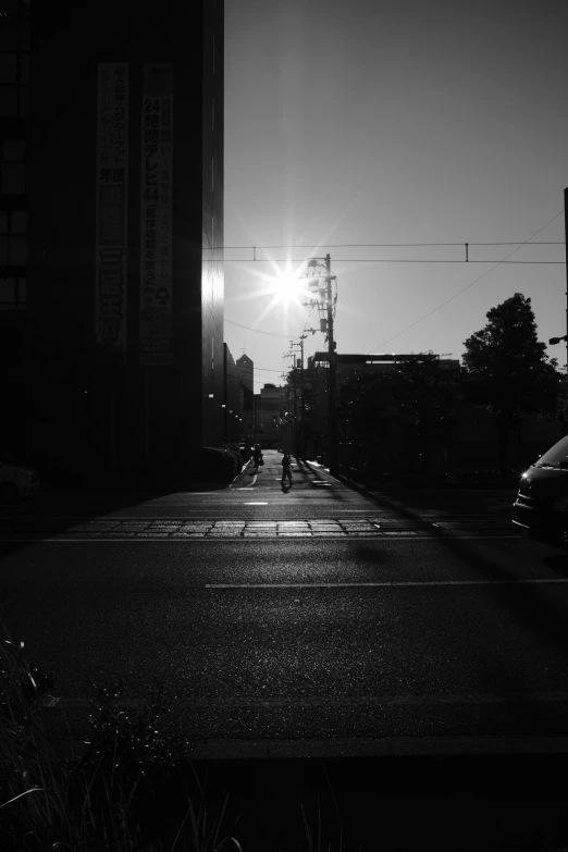 the setting sun shines brightly in the black and white po