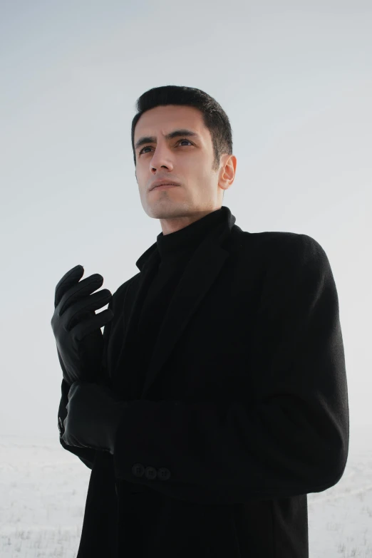 a man in black wearing a black jacket