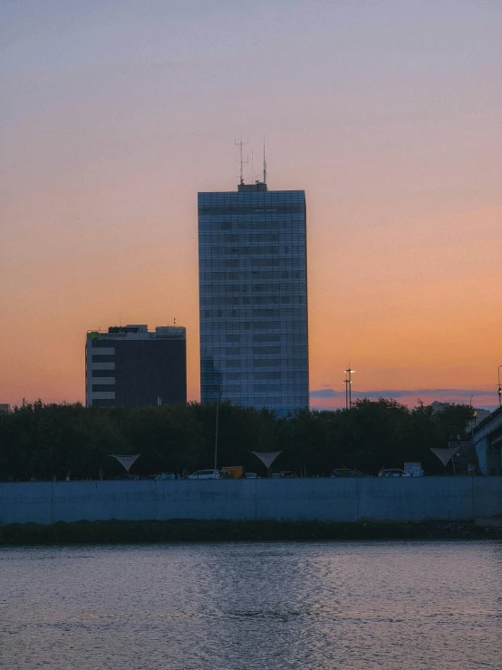 a sail boat with the city in the background