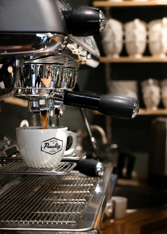 this is an image of coffee being poured into a cup