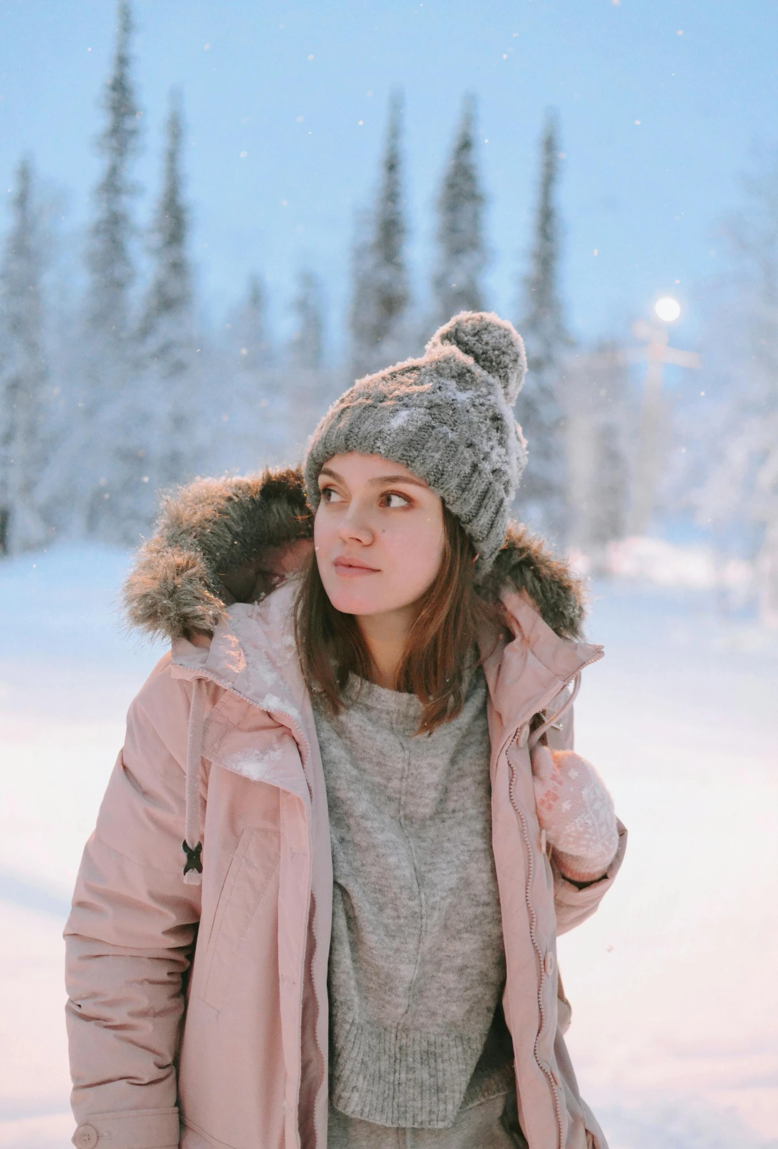 a woman is wearing a hat and jacket with sherpash on