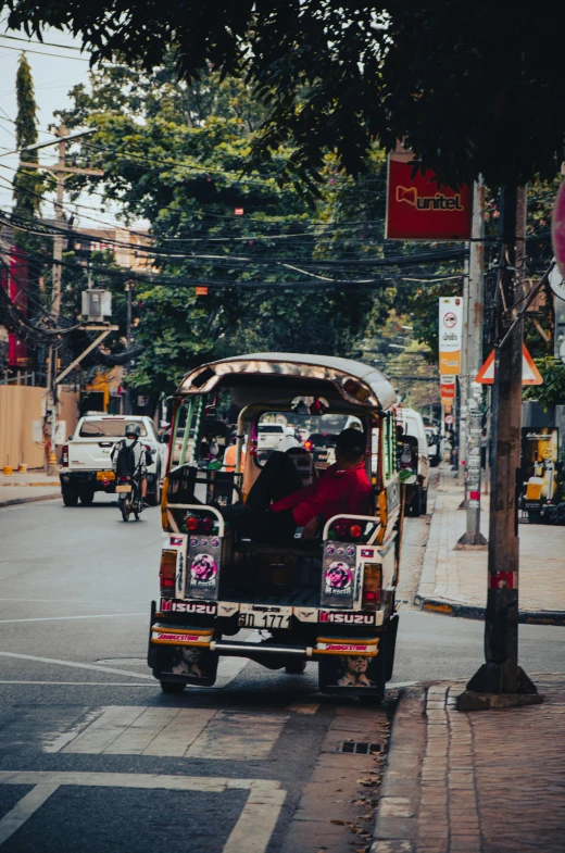 several people are riding in a vehicle that has been decorated with floral motifs