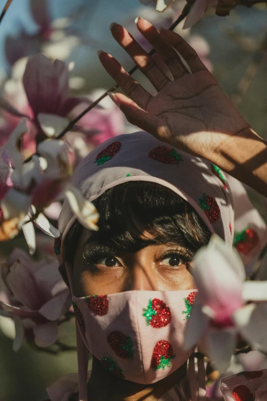 an image of a person in the shade wearing a face covering