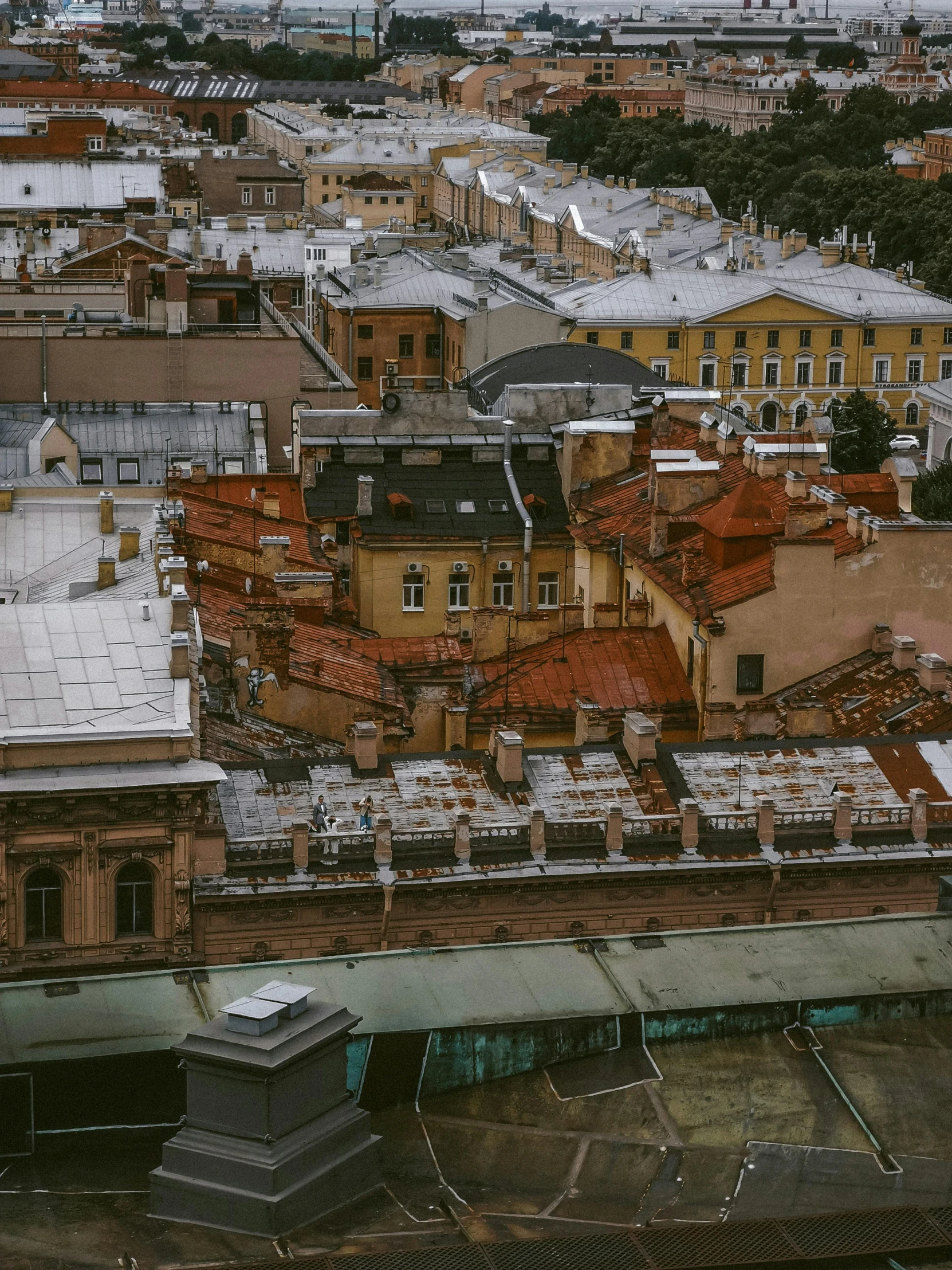 the rooftops of a city with roofs and buildings