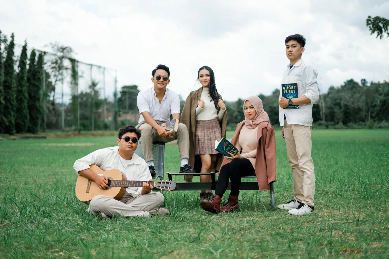 four people pose for a po together while wearing sunglasses