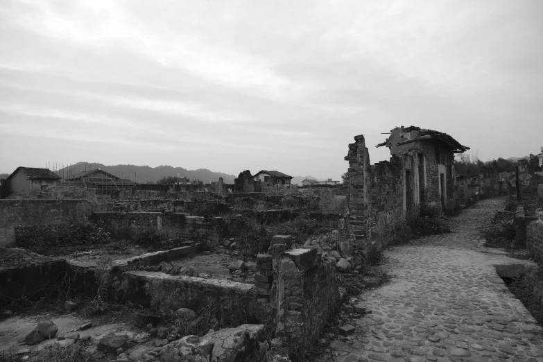 black and white po of a ruins in a village