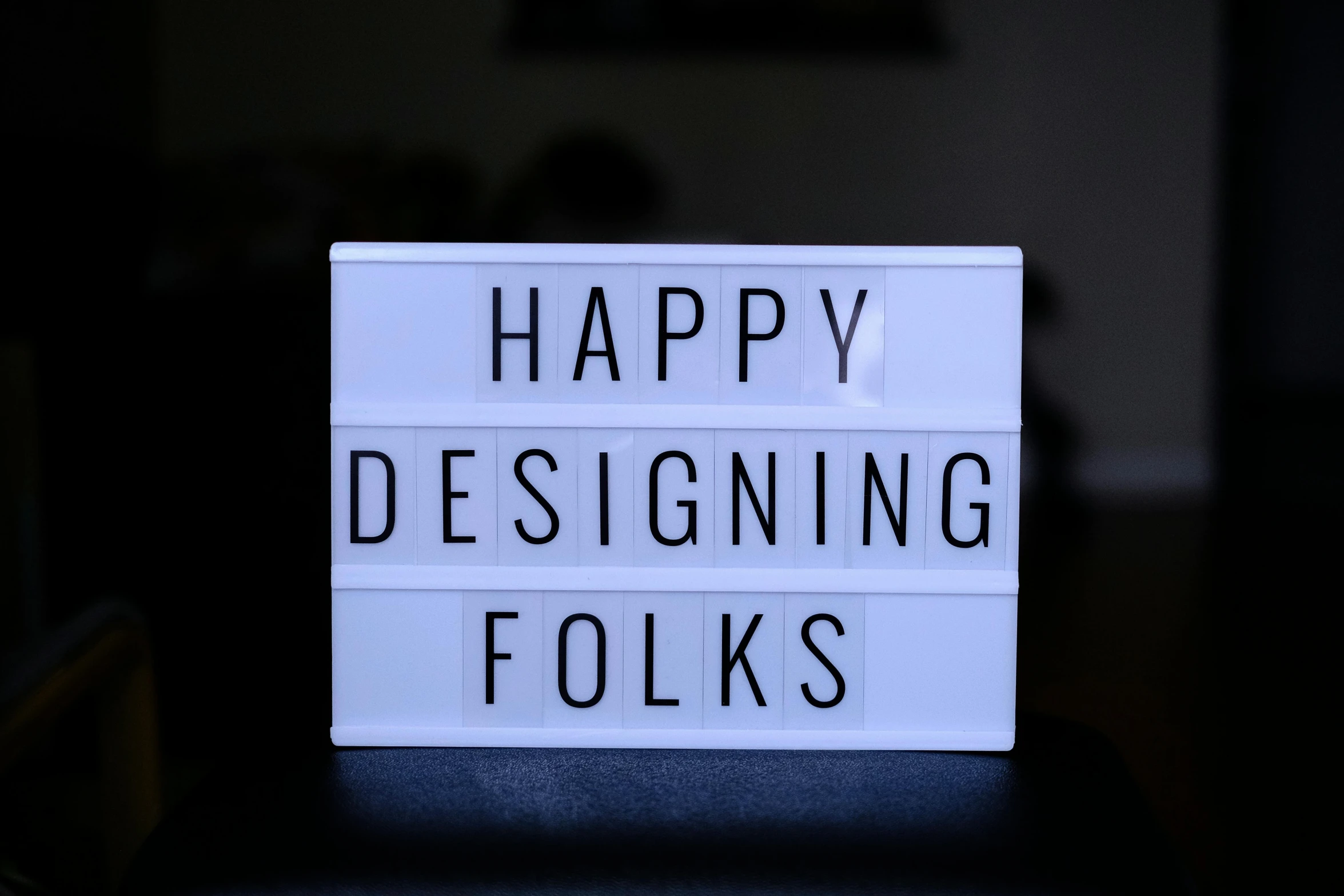 a lightbox reads happy designing folks