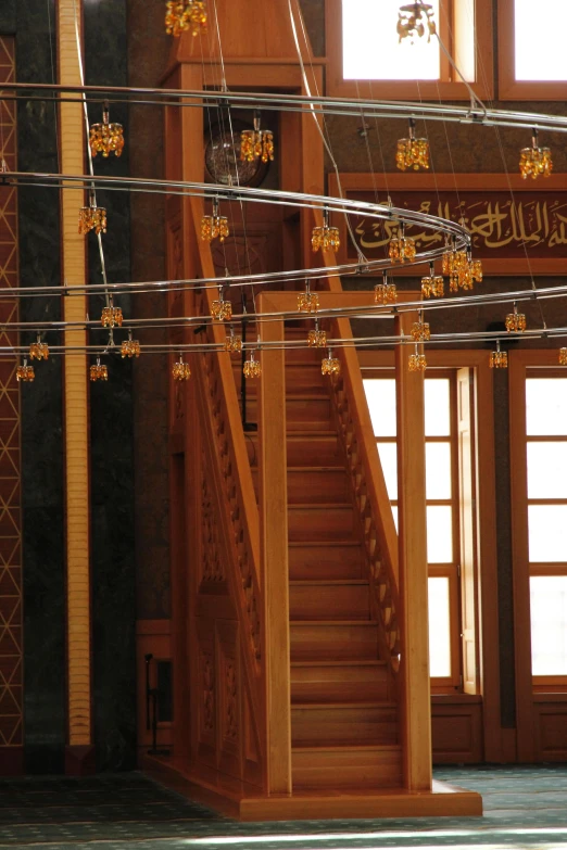 string lights strung on the ceiling above a staircase