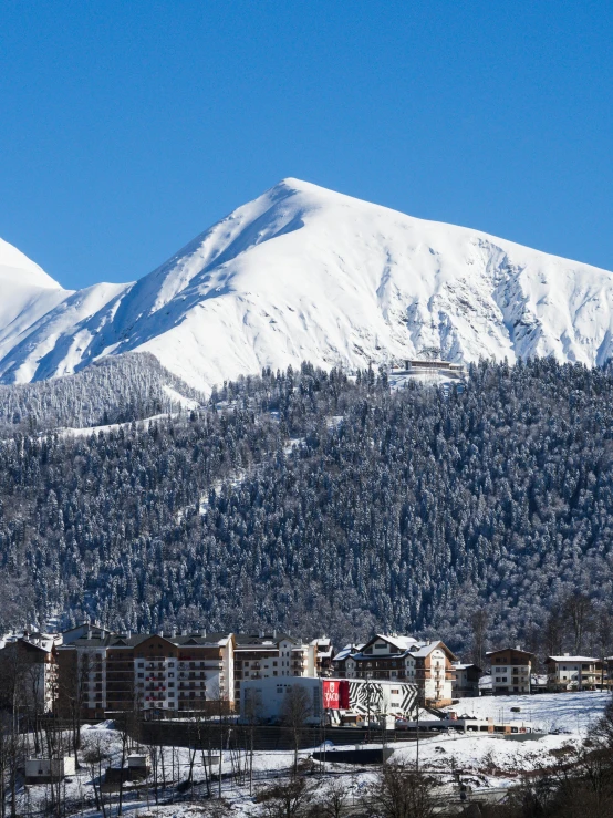 a mountain and some buildings in the foreground