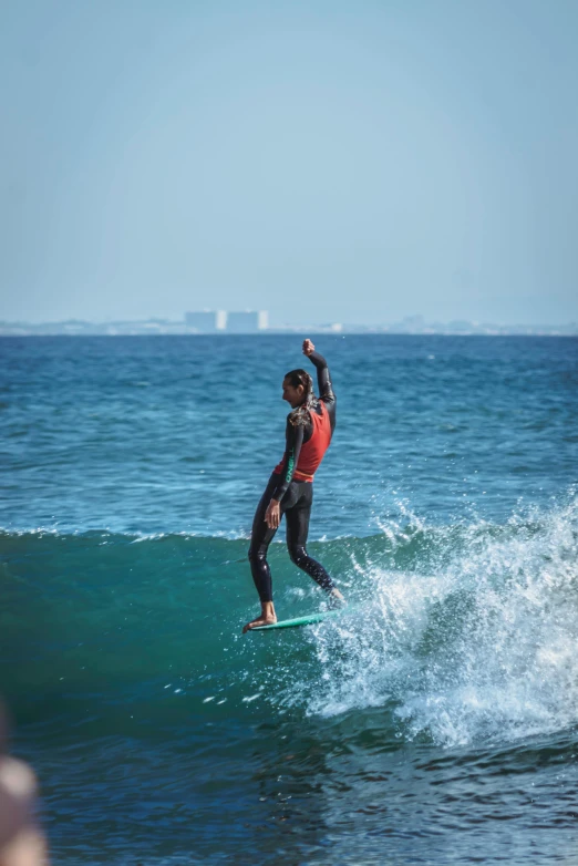 the surfer is getting ready to ride a wave