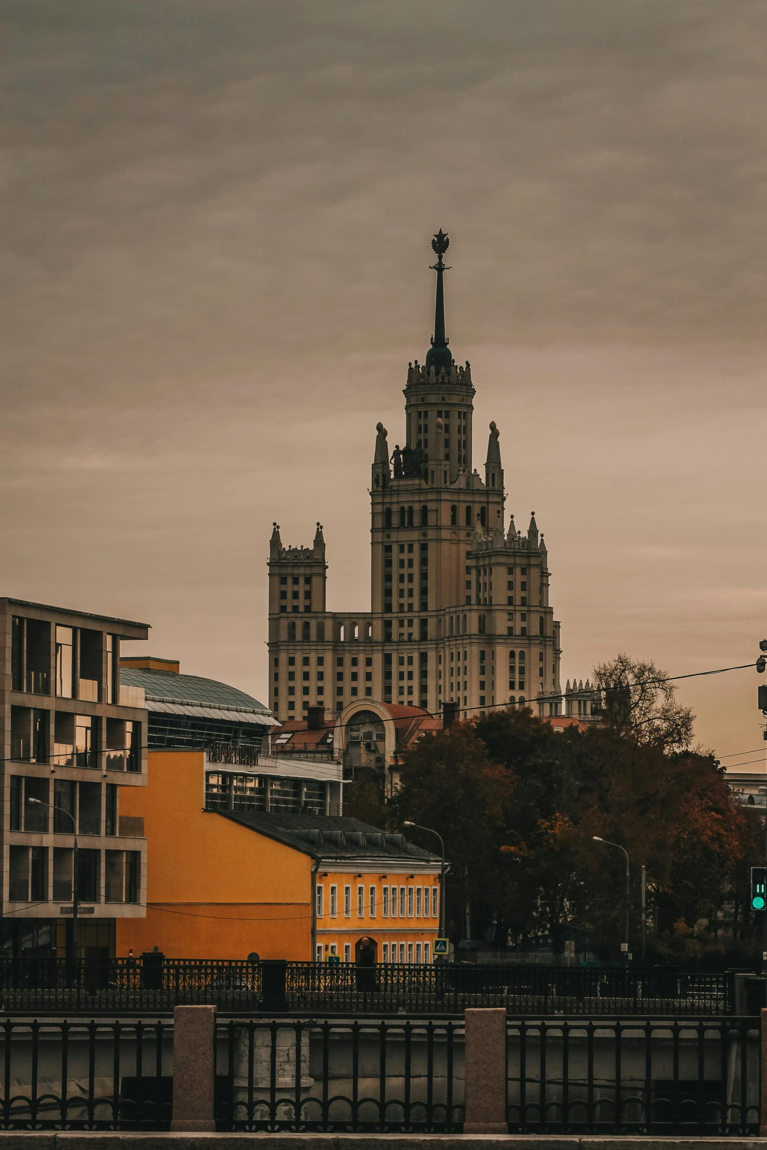 a building with two towers and other buildings behind it