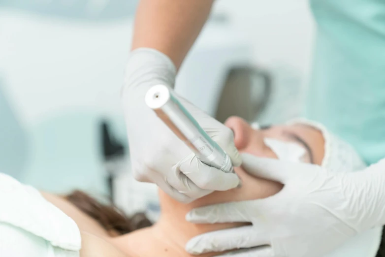 a person getting their eyes examined by a medical staff