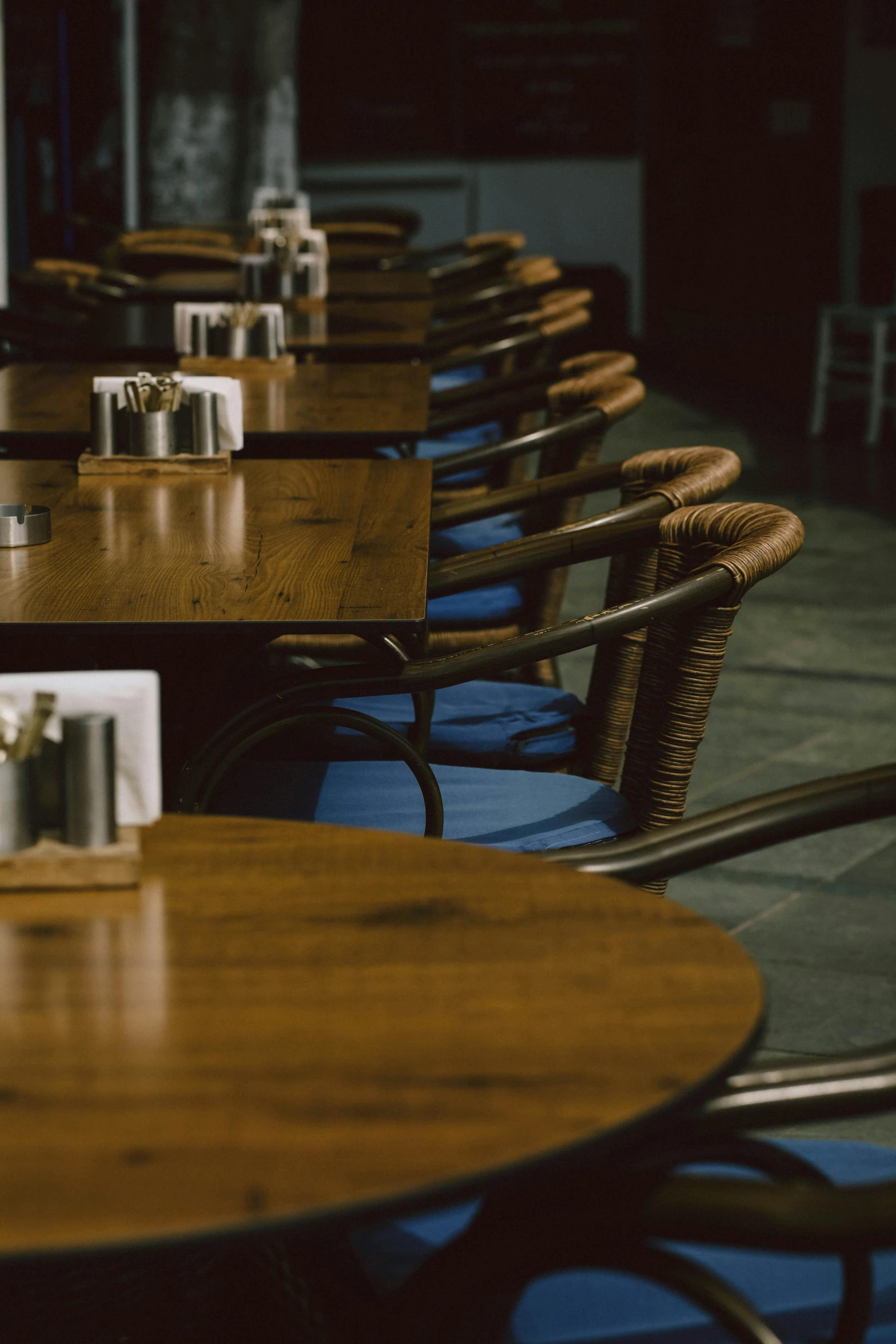 a table is sitting in the middle of rows of chairs