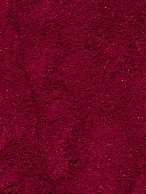 an abstract maroon color on the carpet texture with a high resolution image