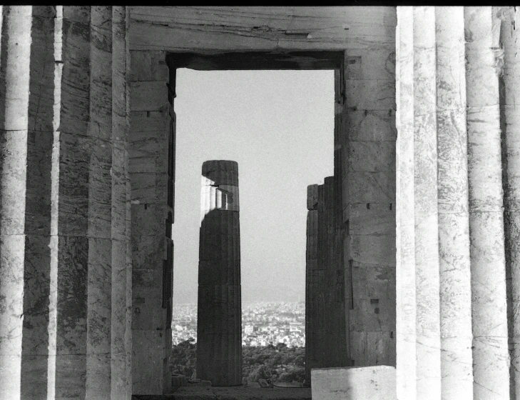 a window with columns looking into a city