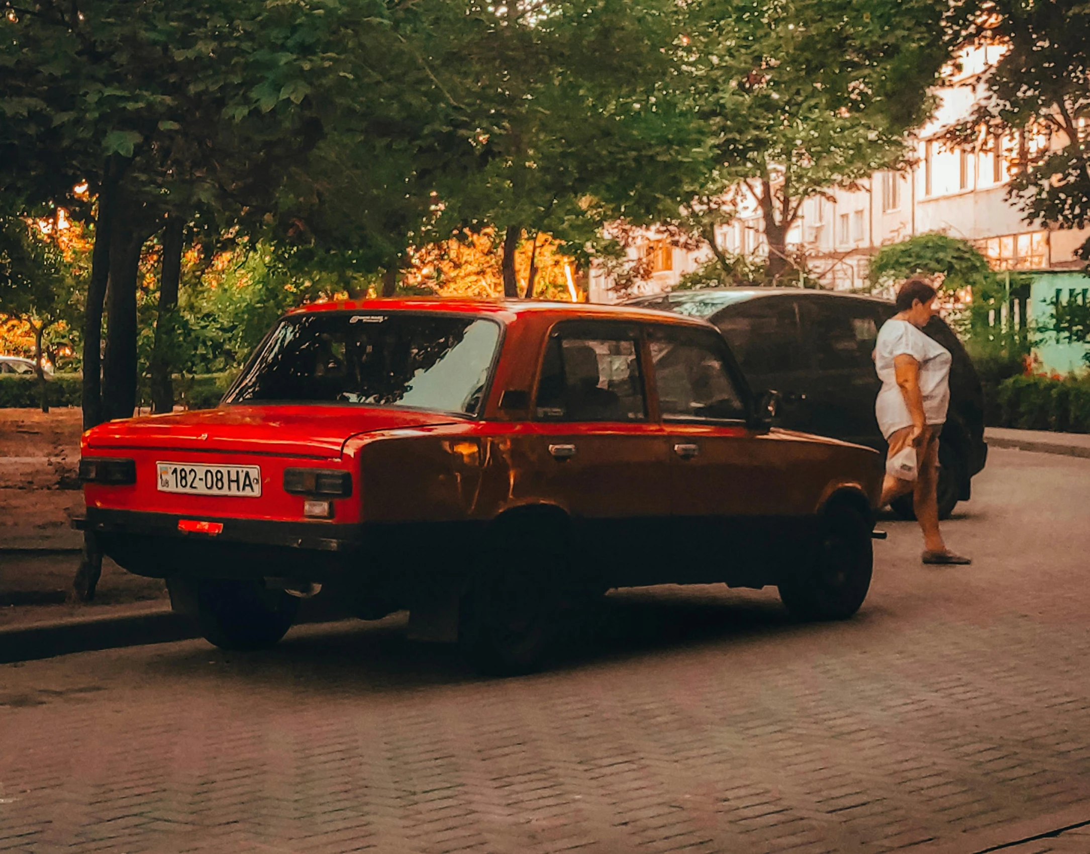 a red van parked on the side of the road