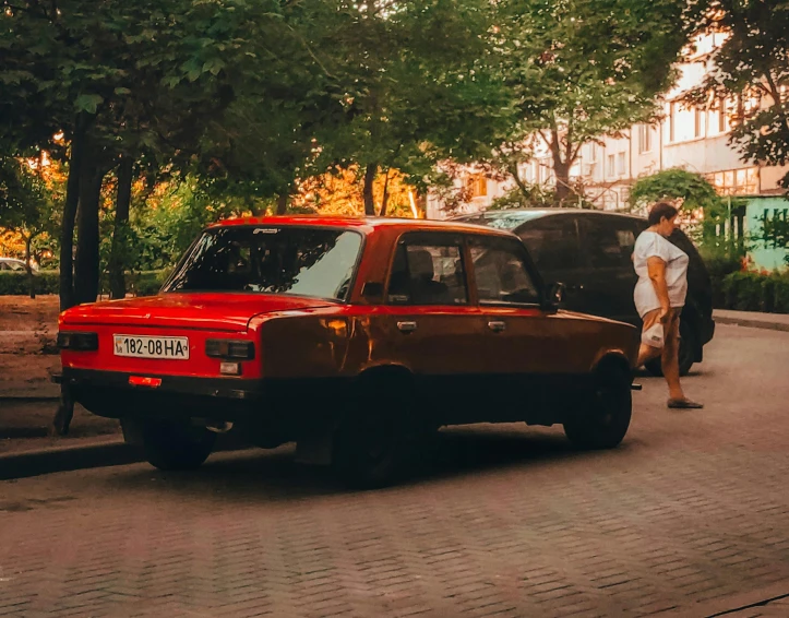 a red van parked on the side of the road