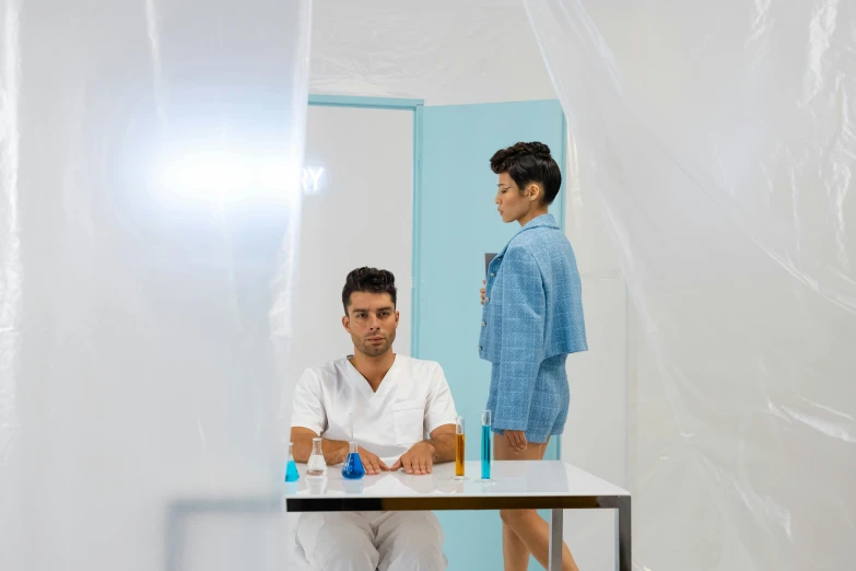 a couple of men sitting down at a table