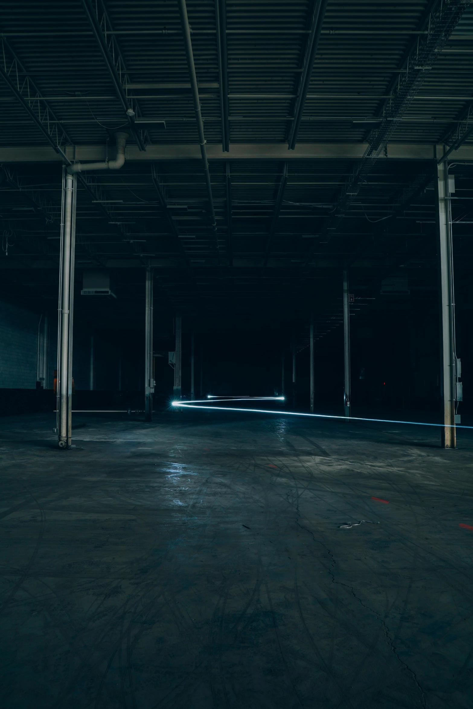 dark parking lot with street lights visible from overhead