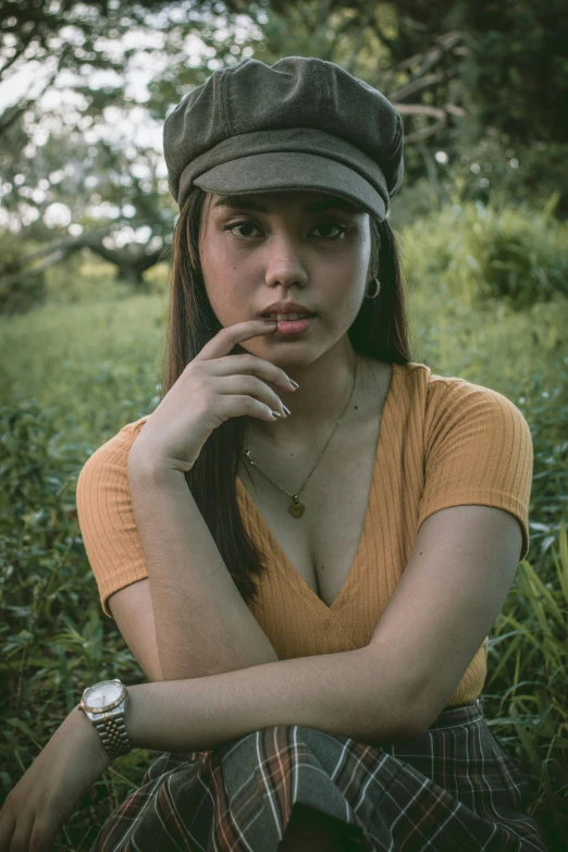 an old pograph of a girl in a cap