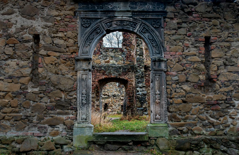 an arch in the wall of a stone church