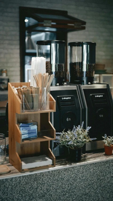 a counter with lots of appliances and accessories on it