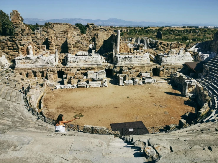 the inside of an ancient theatre looking down